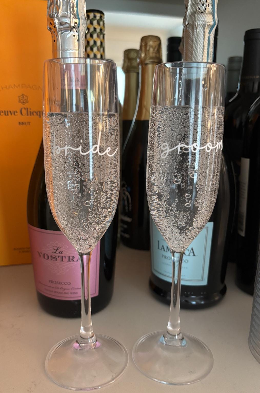 Personalized clear acrylic champagne glasses, bride and groom set