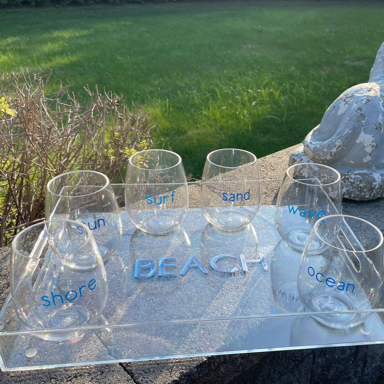 Personalized 11" x 14" clear acrylic tray with vinyl BEACH in the center and 6 stemless wine glasses with fun beachy sayings