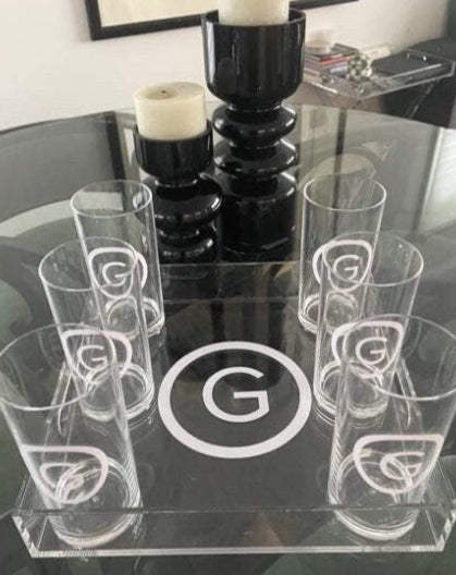 Personalized 12" x 12" clear acrylic tray with a vinyl monogram in the center and 6 monogrammed glasses