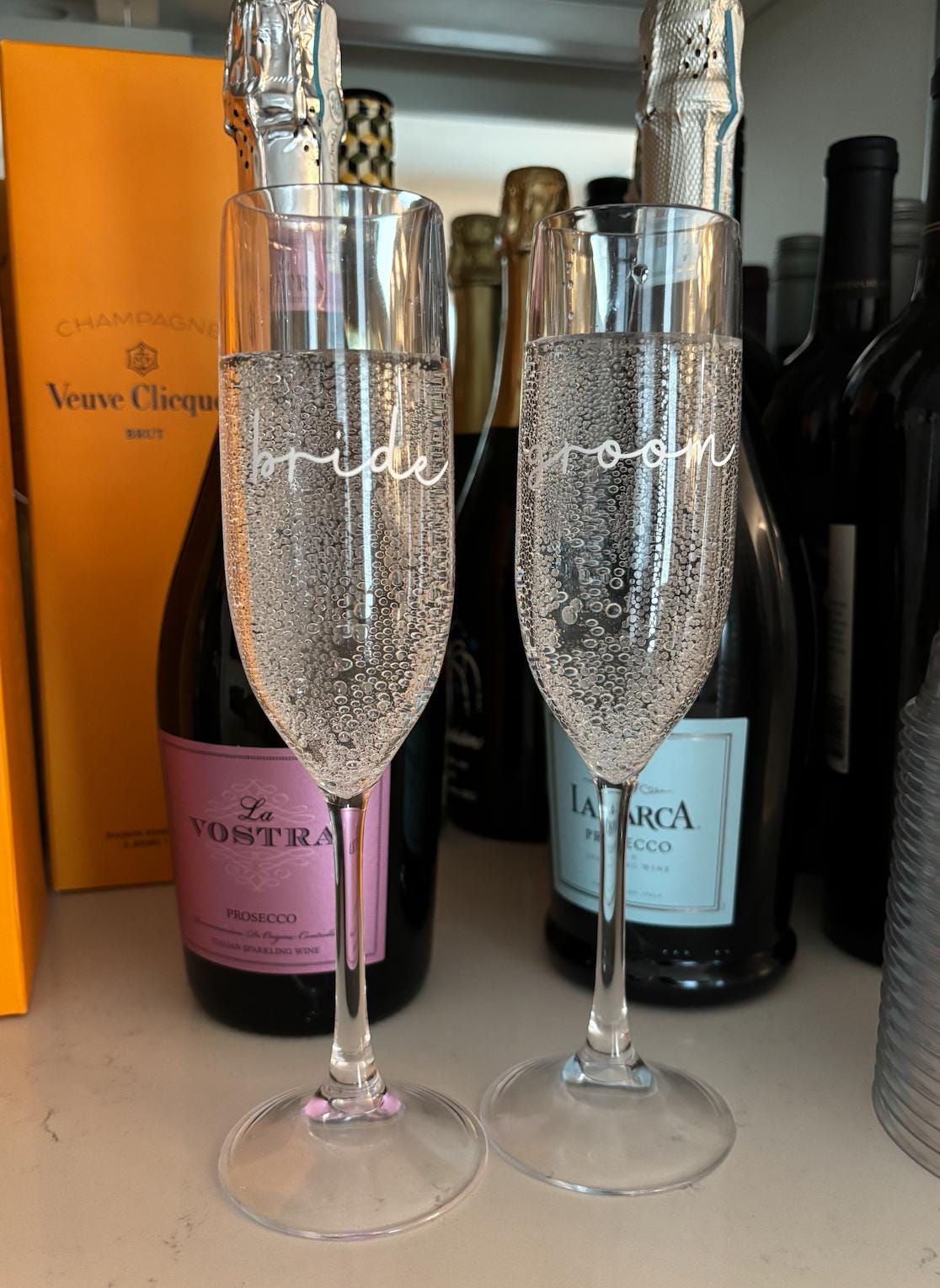Personalized clear acrylic champagne glasses, bride and groom set