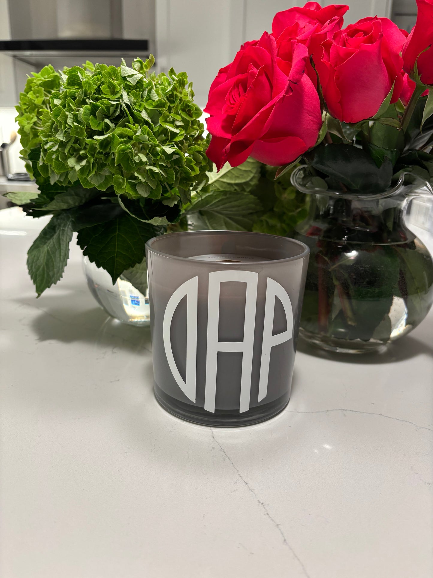 Personalized 7.8 ounce gray candle with a three letter modern monogram
