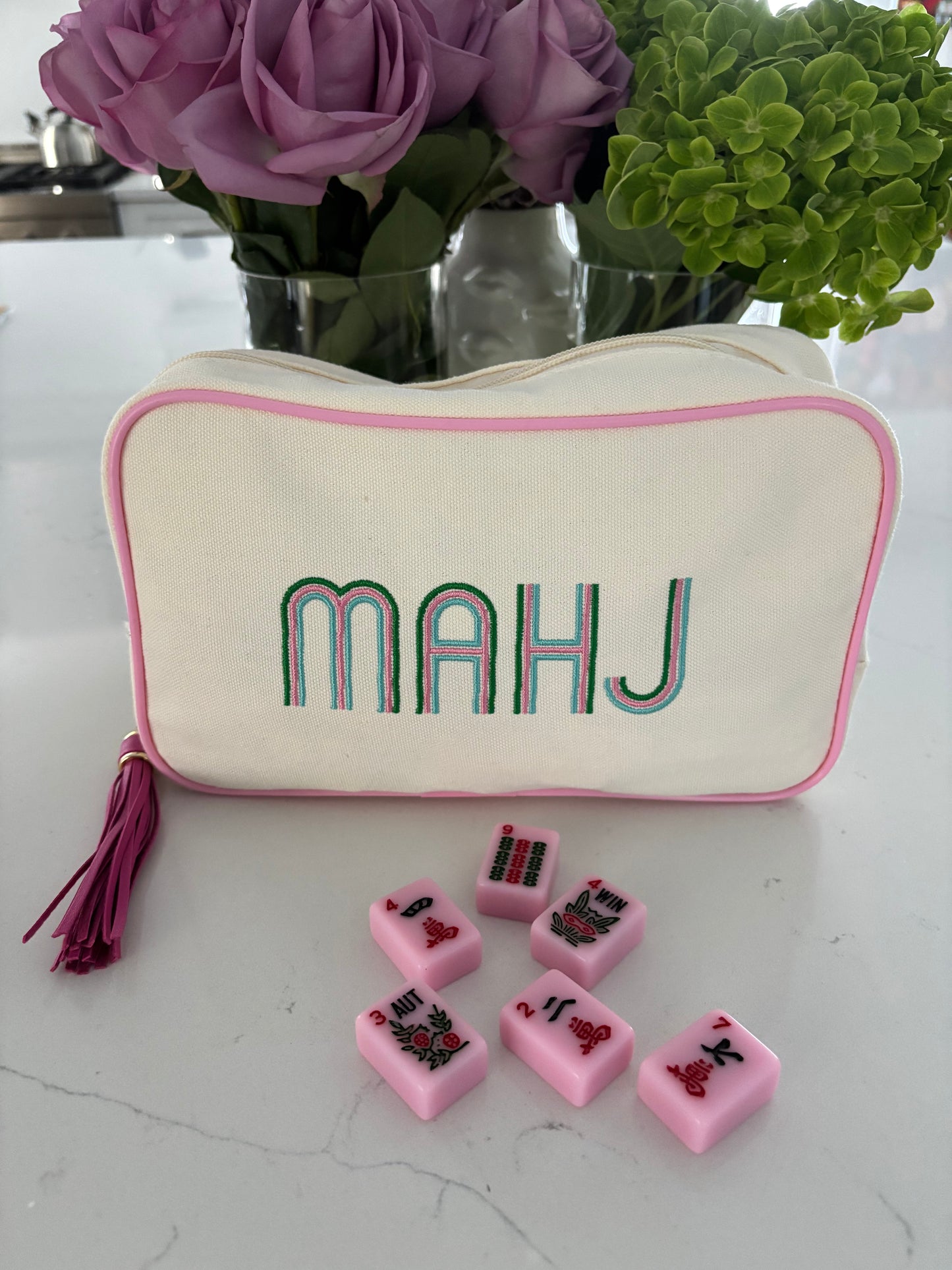 Ivory canvas mahjong tile bag with a full set of pink mahjong tiles