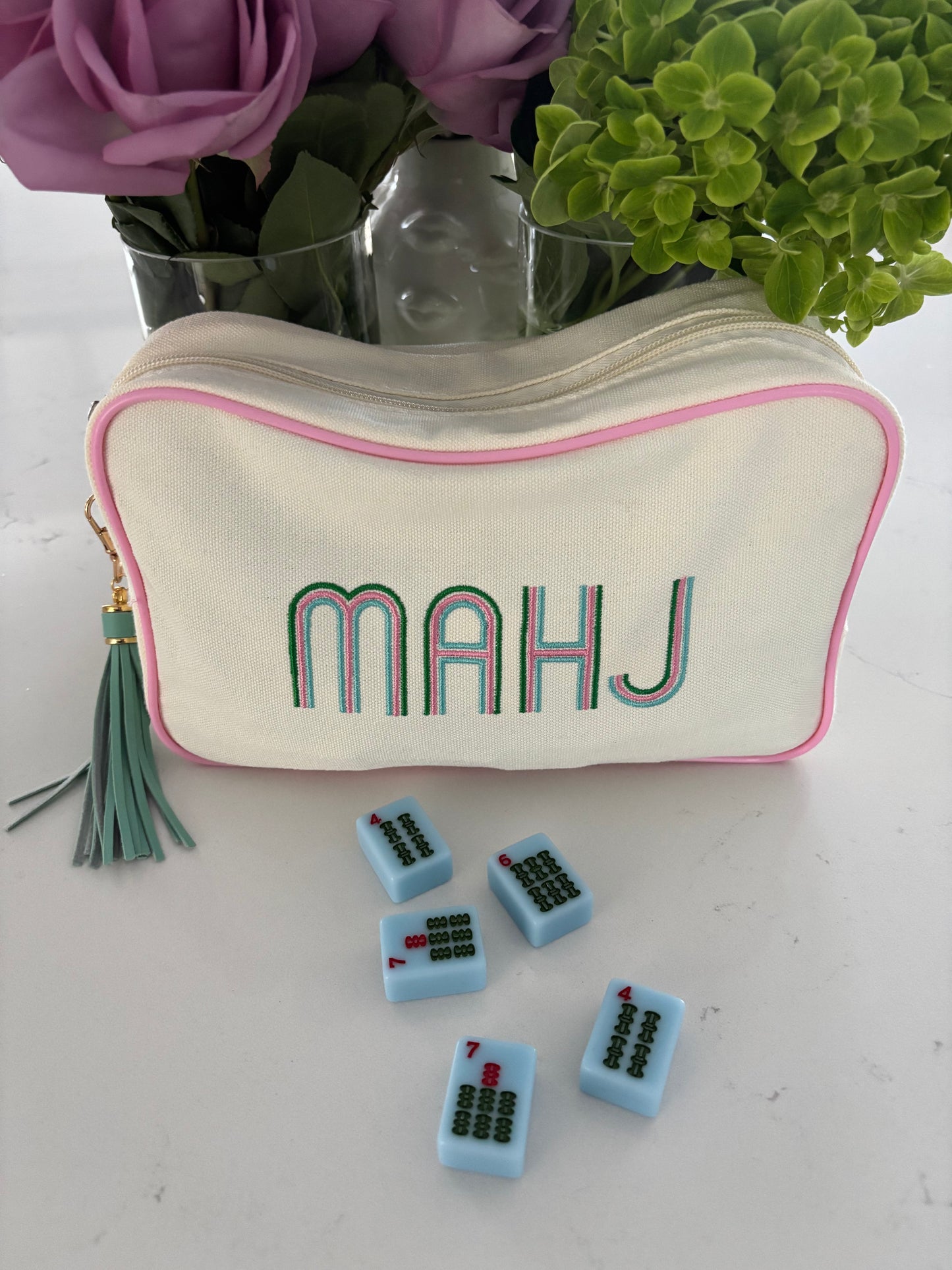 Ivory canvas mahjong tile bag with a full set of blue mahjong tiles