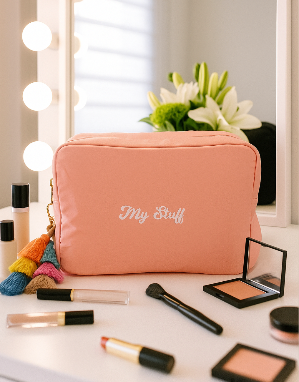 Pink nylon makeup bag with my stuff and tassel