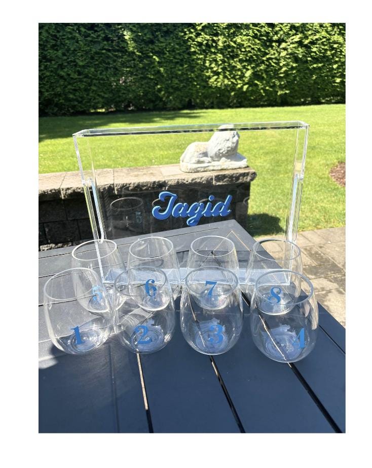 personalized 11" x 14" clear acrylic tray with vinyl BEACH in the center and 6 stemless wine glasses with fun beachy sayings